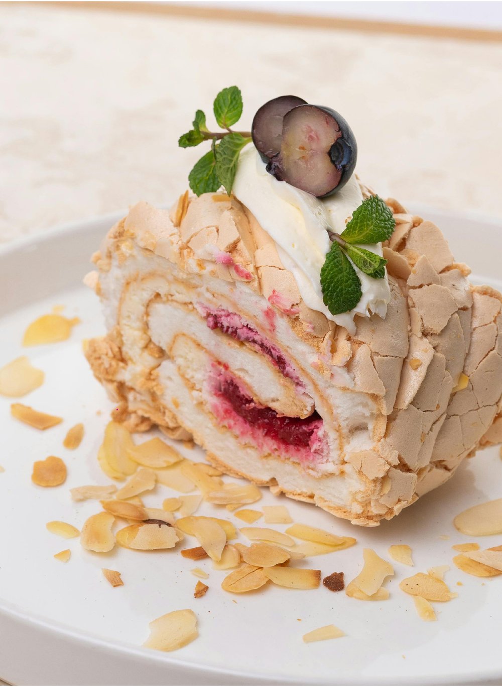 Page 2 — full-bleed pavlova dessert photo